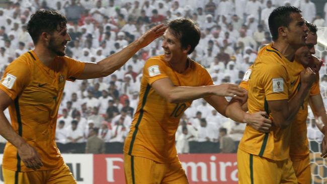 Australia's players celebrate after winning the World Cup 2018 Asia qualifying football match.