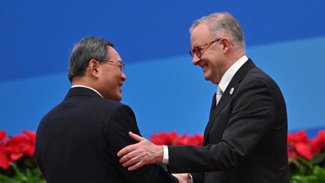 Chinese Premier Li Qiang and Anthony Albanese shake hands in Shanghai on Sunday. Picture: AFP