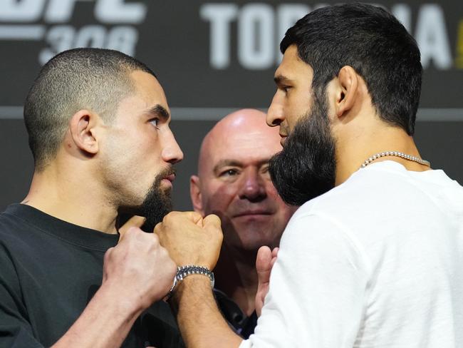 ABU DHABI, UNITED ARAB EMIRATES - OCTOBER 24: (L-R) Opponents Robert Whittaker of New Zealand and Khamzat Chimaev of Russia face off during the UFC 308 press conference at Etihad Arena on October 24, 2024 in Abu Dhabi, United Arab Emirates.  (Photo by Chris Unger/Zuffa LLC)