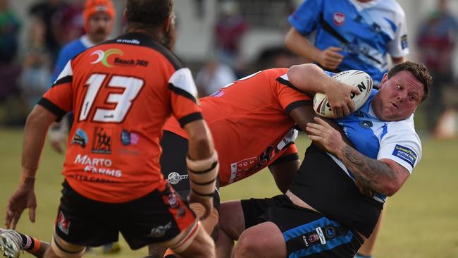 19/04/2023 - South Kolan Sharks’ Phil Lindsay, who scored a try double, gets tackled in the win over the Avondale Tigers in the NDRL. Picture: robertredfern.fotomerchant.com