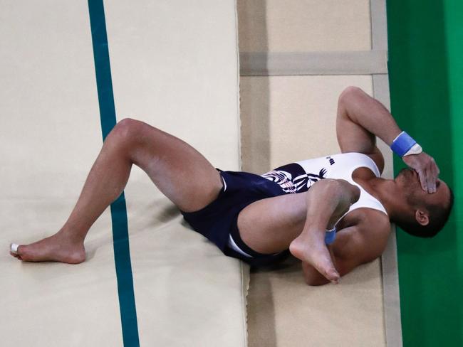 France's Samir Ait Said reacts after injuring his leg while competing in the qualifying for the men's vault event of the Artistic Gymnastics at the Olympic Arena during the Rio 2016 Olympic Games in Rio de Janeiro on August 6, 2016. / AFP PHOTO / Thomas COEX