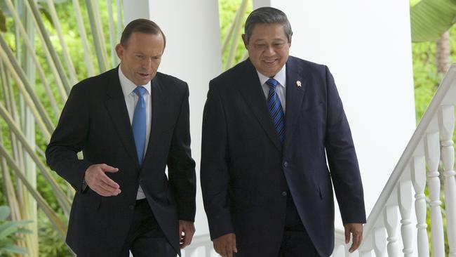 Tony Abbott chats withSusilo Bambang Yudhoyono as they walk to a meeting at a resort on Batam Island last June. Picture: Ed Wray