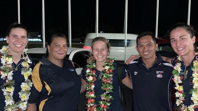 Crows AFLW co-captain Chelsea Randall (L) with teammates Nikki Gore and Angela Foley and AFLNauru representatives in Nauru. Picture: Adelaide Crows