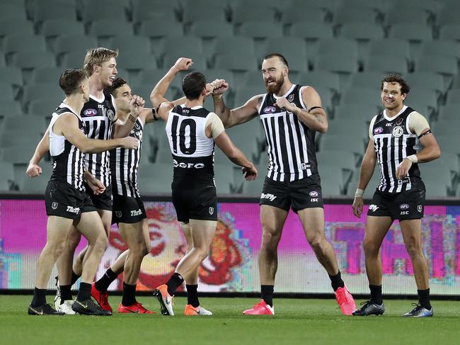 AFL - SHOWDOWN 48 - Port Adelaide v Adelaide Crows at the Adelaide Oval. Charlie Dixon celebrates his goal with Team mates Picture SARAH REED