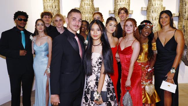 Melody Neal and her date Hunter Smith celebrate the end of Grade 12 in 2023 with friends at the Peace Lutheran College formal evening in 2023. Picture: Brendan Radke