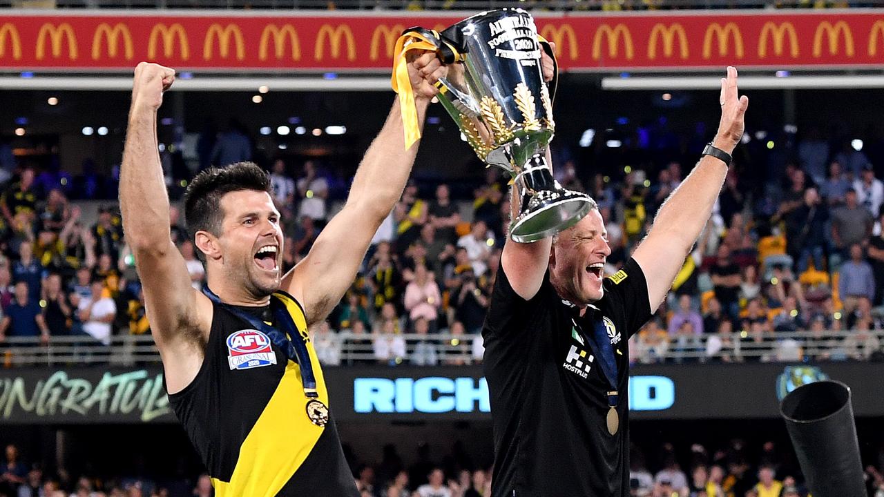 Trent Cotchin and Damien Hardwick hold up the premiership cup, but 2020 wasn’t always looking so positive for the Richmond coach.