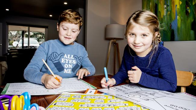 Eddie and Monique Dupuche enjoy the remote learning tasks set for them by their primary school. Picture: Nicole Cleary