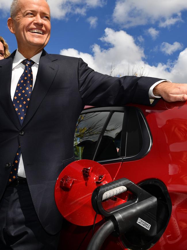 Opposition Leader Bill Shorten charges an electric car. 