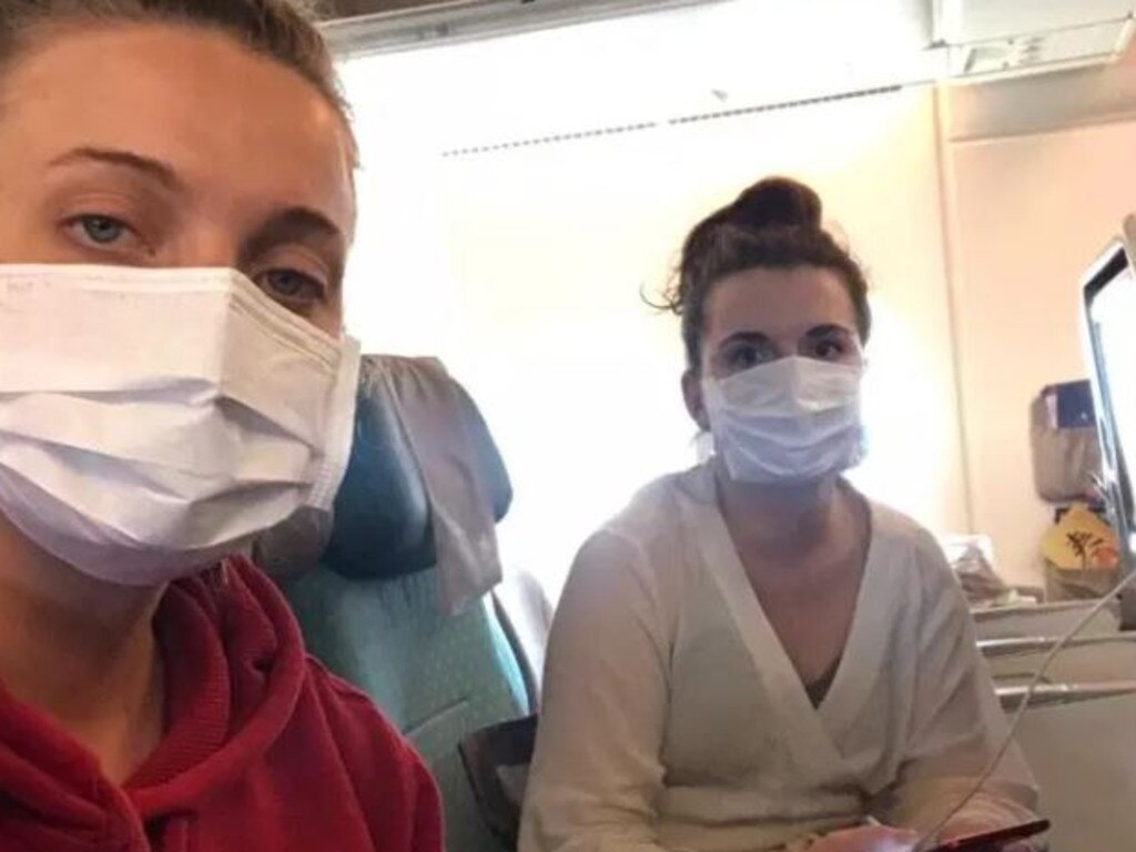 The pair were made to wait on the empty plane so they could be safely taken into lock down. Picture: Julia Walentin