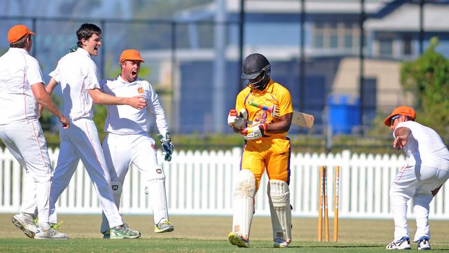 Rhys Howarth (third from left) and his Runaway Bay teammates celebrate after Stuart Frost bowls Palm Beach Currumbin opener Jack Vare Kevere. Picture: John Gass