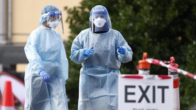 Health workers at the COVID testing centre next to the Palais Theatre at St Kilda. Picture: NCA NewsWire / Daniel Pockett