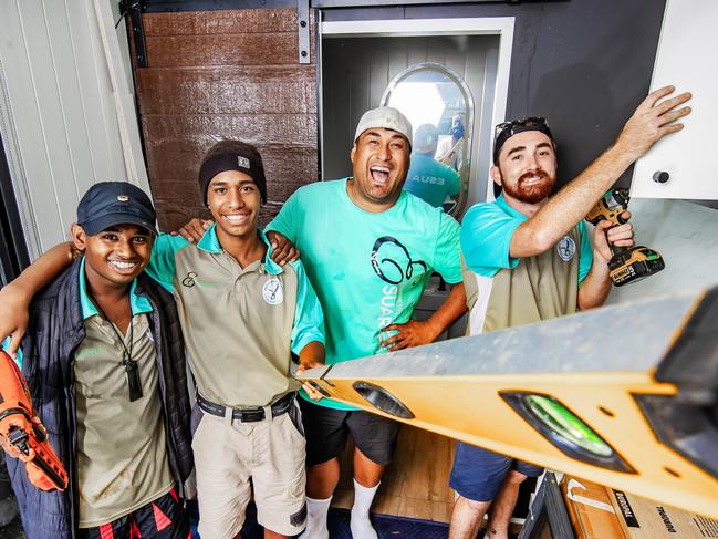 Tiny Homes, charity working with troubled youth and the Courier Mail Children's fundbuilding a tiny home to be given away.Joseph Te Puni-Fromont with Ari Rasheed, 16 (hat), Simi Toru, 16 (Beenie) and Lenny Stone, 23.Picture: Nigel Hallett