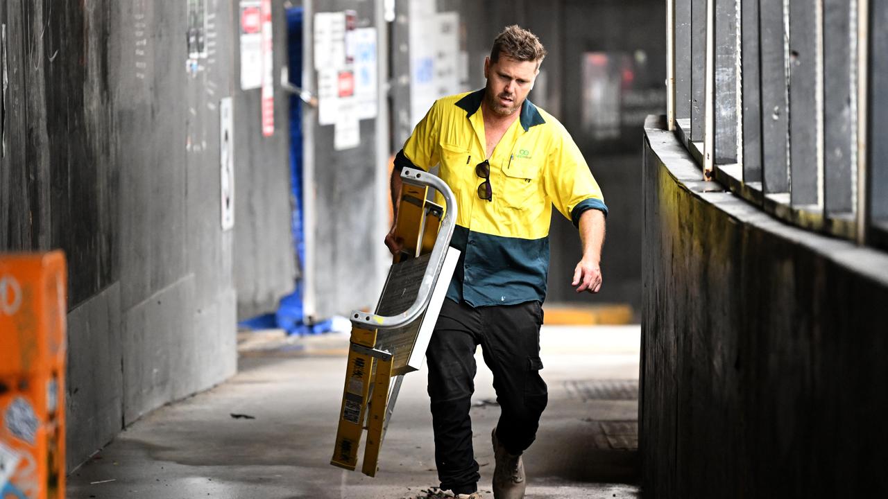 Sub-contractors and tradesmen pack up their equipment and walk off the 443 Queens Street construction site. Picture: Dan Peled/NCA NewsWire