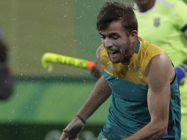 Australia's Jake Whetton, right, fight for the ball against Brazil's Ernst Rost Onnes, left, during a men's field hockey match at 2016 Summer Olympics in Rio de Janeiro, Brazil, Friday, Aug. 12, 2016. (AP Photo/Hussein Malla)