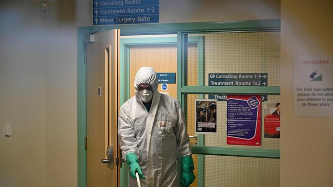 A worker in protective clothing, including face mask and gloves. Picture: Glyn Kirk/AFP