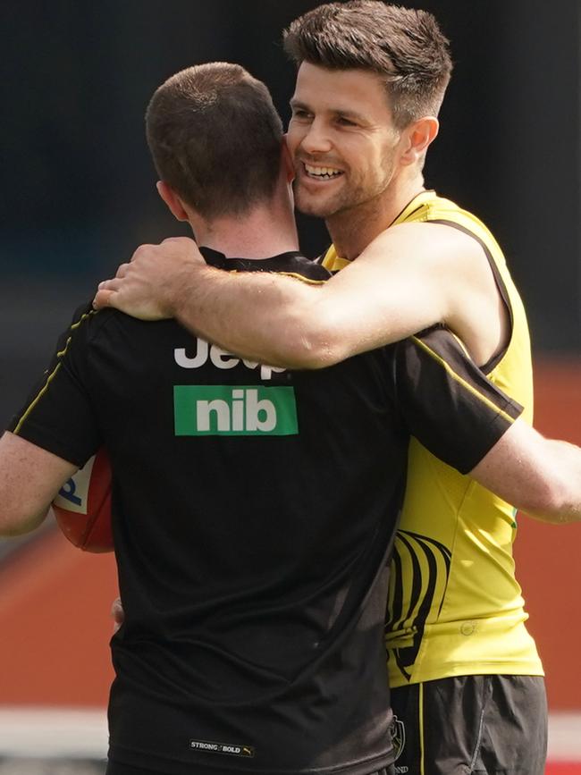 Tigers captain Trent Cotchin gives Jack Higgins a hug.