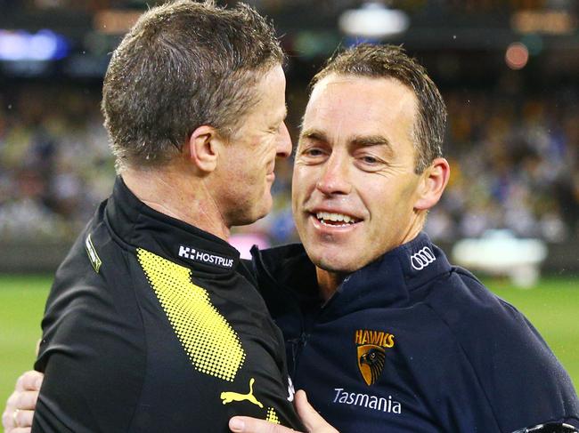 MELBOURNE, VICTORIA - SEPTEMBER 06:  Tigers head coach Damien Hardwick (L) and Hawks head coach Alastair Clarkson embrace during the AFL First Qualifying Final match between the Richmond Tigers and the Hawthorn Hawks at Melbourne Cricket Ground on September 6, 2018 in Melbourne, Australia.  (Photo by Michael Dodge/AFL Media/Getty Images)