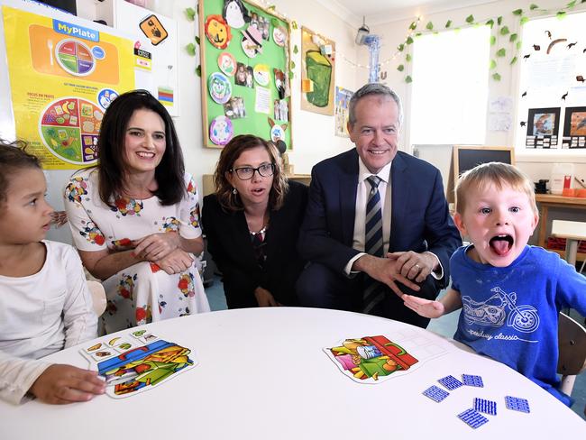 Lucas, 4 (right) reacts as he sits with Labor Candidate for Dickson Ali France (left), Shadow Minister for Early Childhood Education Amanda Rishworth (centre) and Leader of the Opposition Bill Shorten at the Goodstart Early Learning Centre at Albany Creek in Brisbane, Wednesday, October 3, 2018. Mr Shorten used the visit to discuss Prime Minister Scott Morrison's $440 million cut to preschool funding. (AAP Image/Dave Hunt) NO ARCHIVING