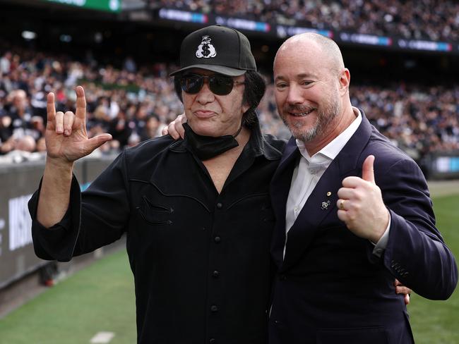 Carlton Blues fan Gene Simmons with club president Luke Sayers after presenting the match-day ball for the clash against the Collingwood Magpies at the MCG. Picture: Michael Klein