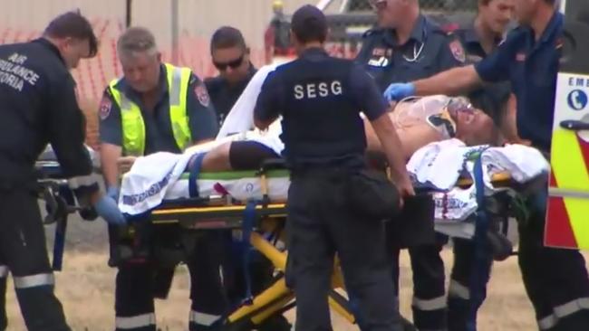 Tony Mokbel is worked on by paramedics at Barwon Prison after the attack. Picture: Nine News