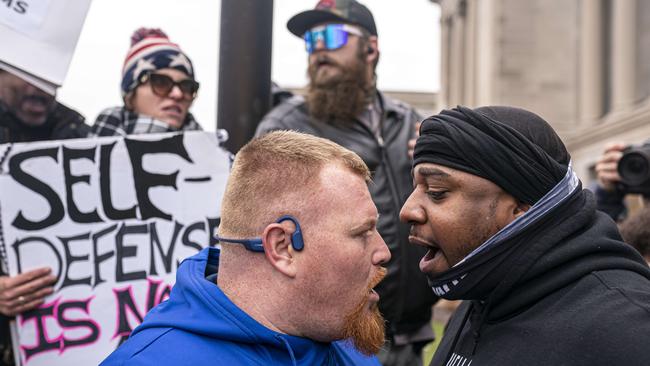 A supporter of Kyle Rittenhouse (left) argues with a Black Lives Matter supporter in front of the Kenosha County Courthouse while the jury deliberates the Rittenhouse trial on November 16, 2021. Picture: Nathan Howard/Getty Images/AFP