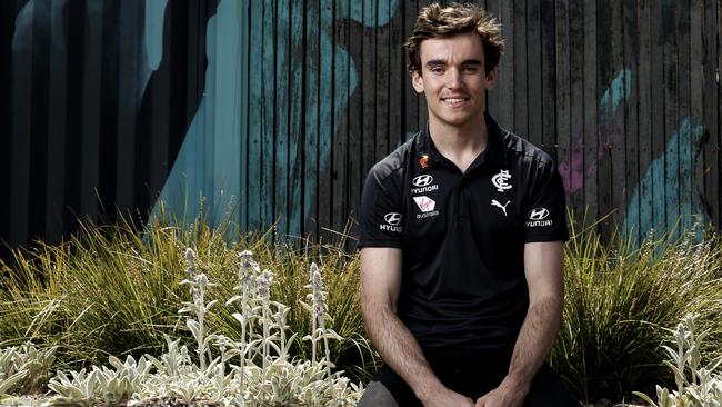 Sam Philp tries on the navy blue after being drafted by Carlton.