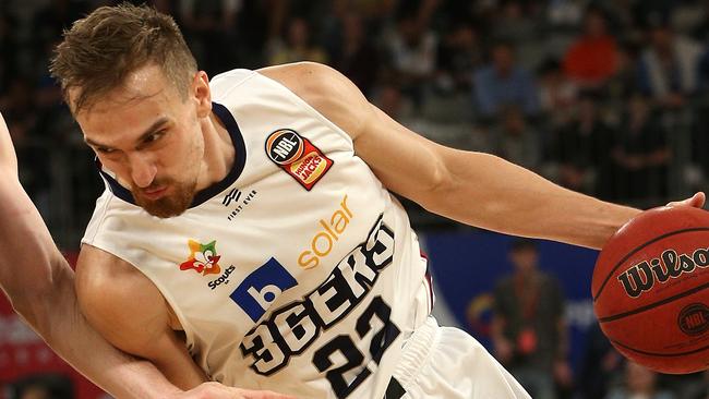 Anthony Drmic of Adelaide (right) contests with Mitch McCarron of Melbourne United during the Round 6 NBL match between the Melbourne United and the Adelaide 36ers at Melbourne Arena in Melbourne, Sunday, November 10, 2019. (AAP Image/Hamish Blair) NO ARCHIVING, EDITORIAL USE ONLY