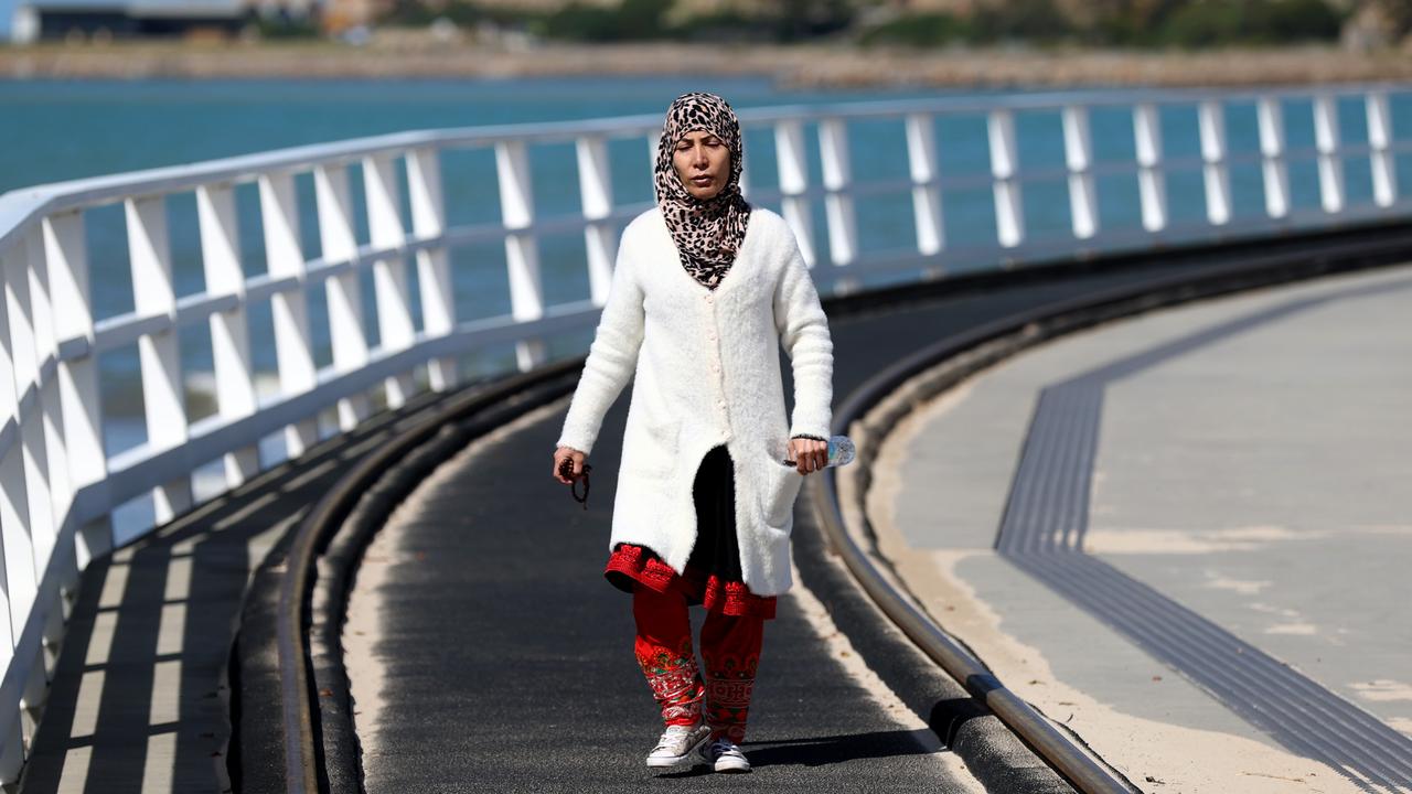 Mother of missing teen Mehdi Habibi walks the across the Granite Island causeway after Police and SES suspended search for Mehdi. Picture: Kelly Barnes