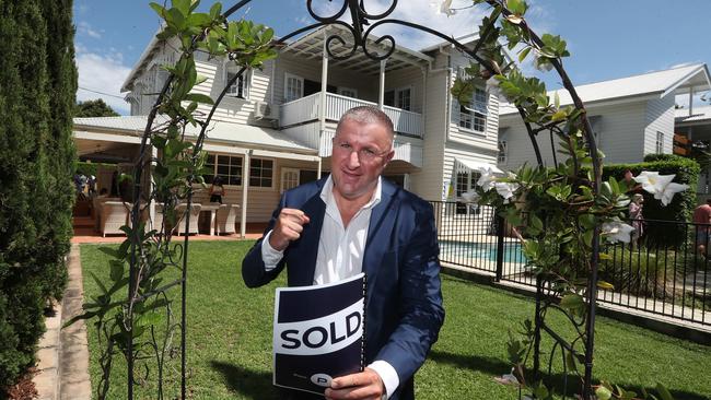 Spring selling season is underway with auctioneers like Peter Burgin of Place Estate Agents taking almost 100 homes to auction across Greater Brisbane on Saturday. Picture: Annette Dew