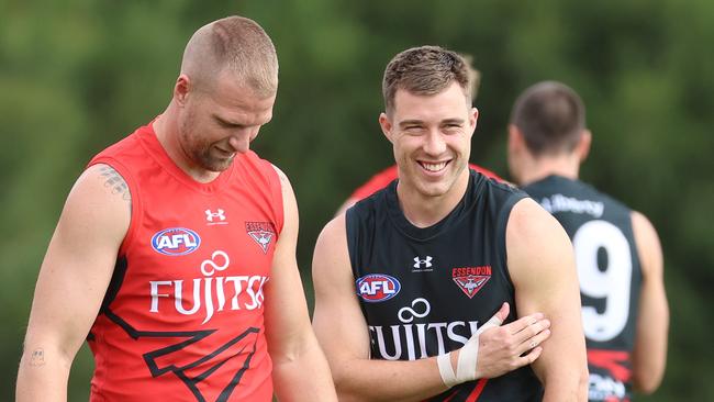 ake Stringer and Essendon skipper Zach Merrett at pre-season training. Picture: Brendan Beckett