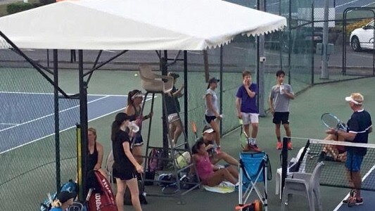 Mike Newell coaches a class at the Beenleigh tennis centre.