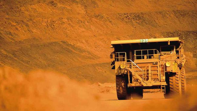 A truck works at the BHP Billiton iron ore mine at Mt Whaleback at Newman in the Pilbara, in undated image released 24/08/05 with teh Anglo-Australian resources group BHP Billiton announced a record full-year net profit.