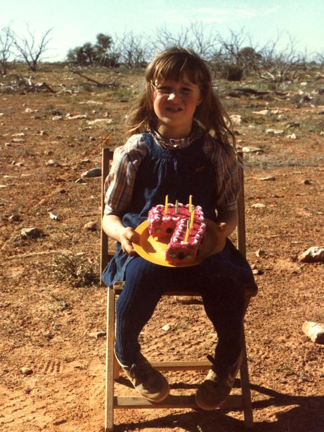 Chambers, aged 7, celebrating her seventh birthday on the Nullarbor with a cake.