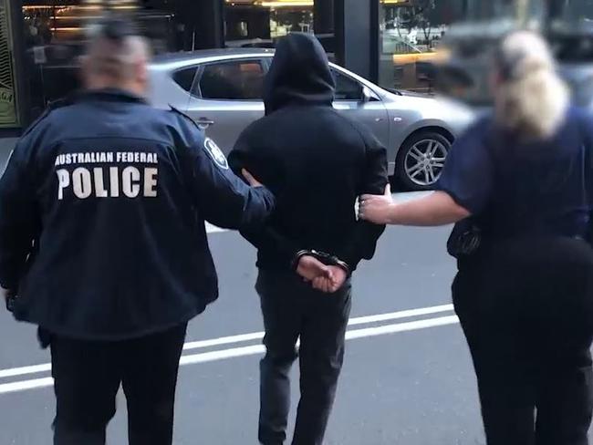 AFP OPERATION IRONSIDE PHASE II, Vison of the arrest of a 38 year-old man and ammunition seized in Barrangaroo., Picture: Supplied Australian Federal Police(AFP), The Australian Federal Police, NSW Police Force and Australian Border Force in Sydney to announce the first wave of results as part of Operation Ironside Phase II in NSW., , , The Australian Federal Police, NSW Police Force and Australian Border Force will address media in Sydney on Friday (17 December 2021) to announce the first wave of results as part of Operation Ironside Phase II in NSW., ,  Eight men are expected to face court following the targeted police activity that resulted in the seizure of encrypted devices, cocaine, cash, firearms and ammunition.