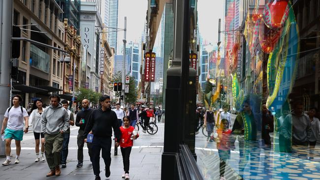 SYDNEY, AUSTRALIA - NewsWire Photos - APRIL 17 2023 - People are seen walking past the Luxury Luis Vuitton Retail Store in central Sydney as the latest financial data shows Aussiesâ online spending dropped by more than $124 million nationwide. Picture NCA NewsWire / Gaye Gerard