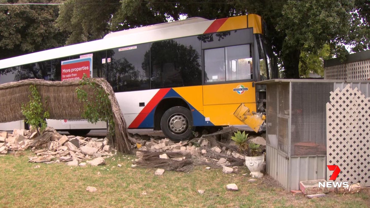 A bus filled with school kids smashed through a fence Friday morning. Picture: 7 News