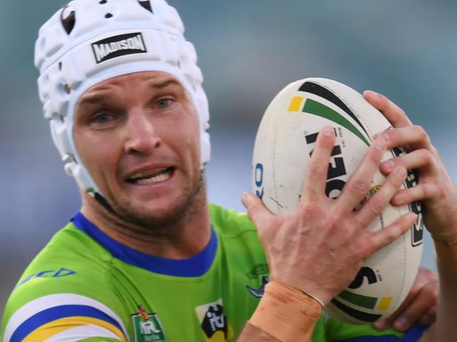 Jarrod Croker of the Raiders is tackled during the Round 9 NRL match between the Canberra Raiders and the Gold Coast Titans at GIO Stadium in Canberra, Saturday, May 5, 2018. (AAP Image/Lukas Coch) NO ARCHIVING, EDITORIAL USE ONLY