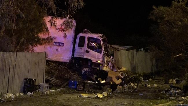 A man was flown to hospital in critical condition after crashing a stolen truck into a house at Watanobbi. Picture: Digicrew Australia