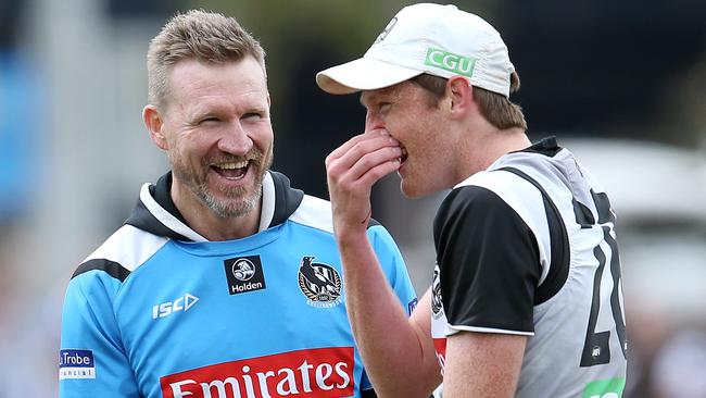 A happier and more relaxed Nathan Buckley shares a joke with Nathan Murphy. Picture: Michael Klein