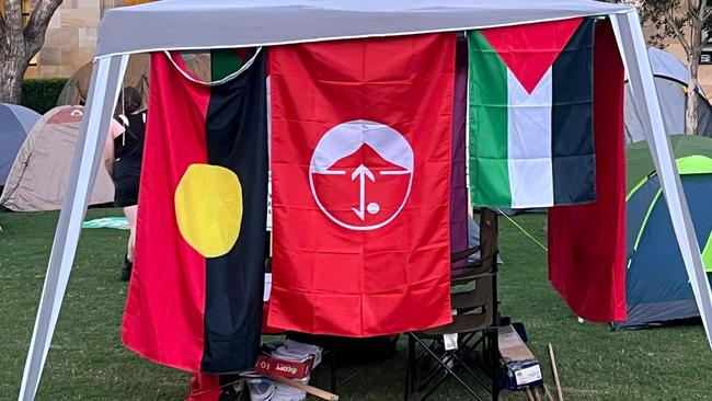 The Popular Front for the Liberation of Palestine flag, centre, was flown at University of Queensland on Wednesday.