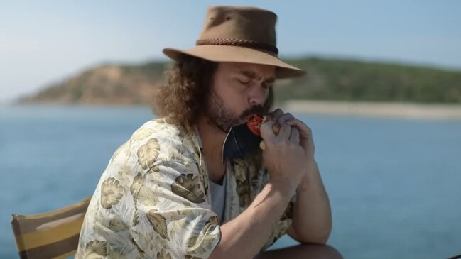A still from a BCF Australia advertising campaign posted to Youtube showing a man eating a bat sandwich. Picture: Youtube