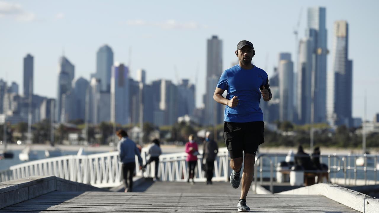 Melburnians soaking up the sun for their hour of exercise at St Kilda Pier in Melbourne, Victoria. Picture: NCA NewsWire / Daniel Pockett