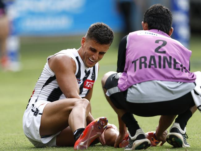 Nick Daicos battles cramp. Picture: Phil Hillyard