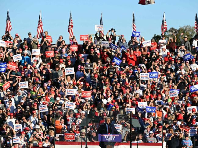 Cheering supporters greet Donald Trump at the campaign rally. Picture: AFP