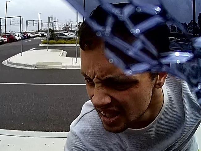 A man looks through the ute.