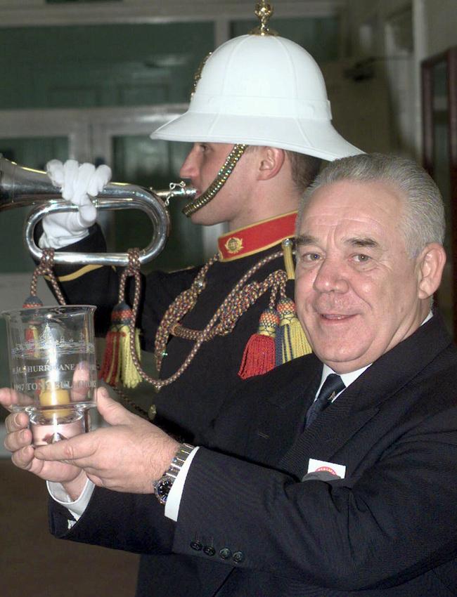 Around-the-world yachtsman Tony Bullimore, who survived for five days in the hull of his capsized catamaran, Global Exide Challenger, holds his HMS Hurricane trophy for bravery and rescues at sea, which was presented to him during an awards ceremony at London's Imperial War Museum in January 1999.