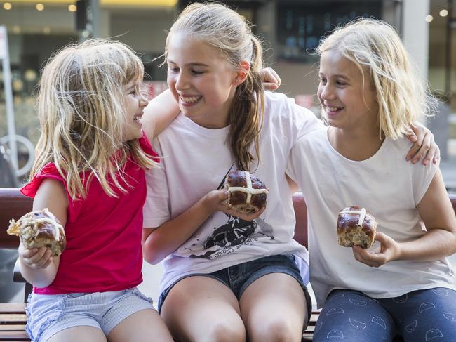 Sisters Eloise, 4, Lucinda, 12, and Sarah, 10, love hot cross buns any time of year. Picture: Dylan Robinson