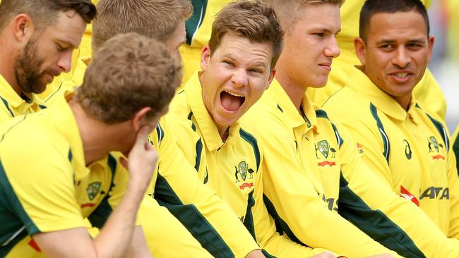 Australia captain Steve Smith (centre) laughs with team mates prior to a team photograph at the start of the third one-day international (ODI) match between New Zealand and Australia at Seddon Park, Hamilton, Monday, Feb. 8, 2016. (AAP Image/SNPA, Martin Hunter) NO ARCHIVING, EDITORIAL USE ONLY, IMAGES TO BE USED FOR NEWS REPORTING PURPOSES ONLY, NO COMMERCIAL USE WHATSOEVER, NO USE IN BOOKS WITHOUT PRIOR WRITTEN CONSENT FROM AAP