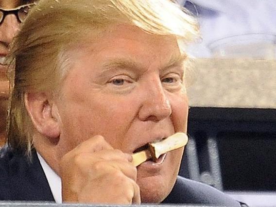 ONLINE ONLY  epa02321994 US business mogul Donald Trump eats an ice cream while watch  Kim Clijsters of Belgium take on Samantha Stosur of Australia in their  Quarterfinals round match at the 2010 US Open Tennis Championship at the USTA National Tennis Center in Flushing, Meadows, New York, USA, 07 September 2010. The US Open Championship runs through 12 September when the men's final is scheduled to be played.  EPA/ANDREW GOMBERT