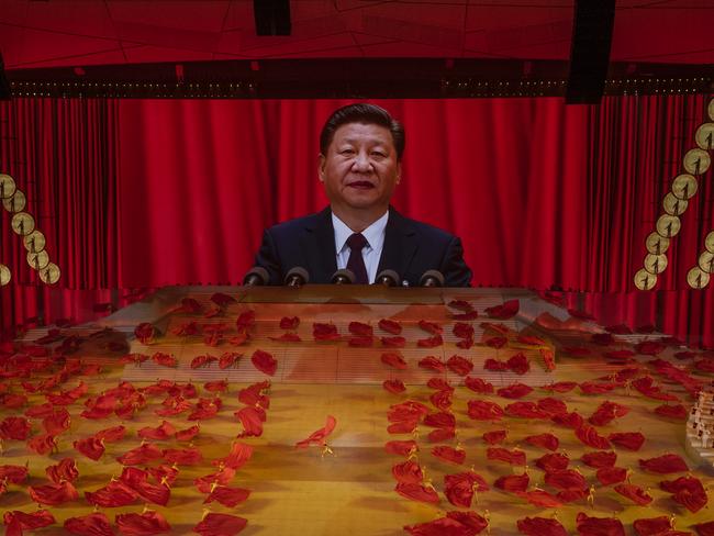 Xi Jinping on a large screen above a gala dance performance. Picture: Getty Images